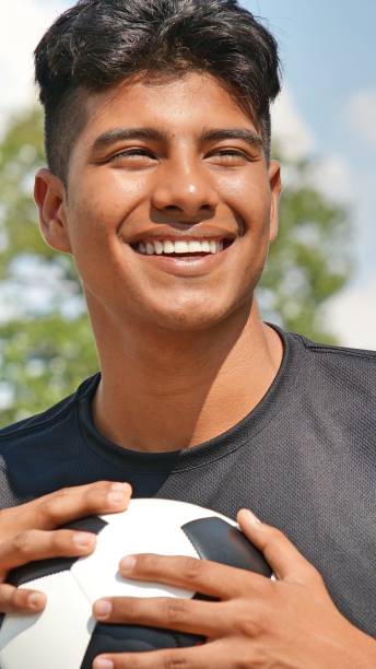 istock Smiling Athletic Male Soccer Player 915371420