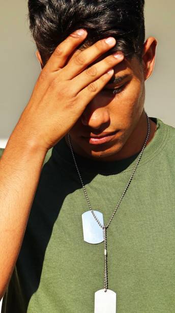 istock Hispanic Male Soldier And Sadness 915372124