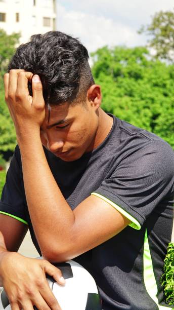 istock Young Male Soccer Player And Sadness 915372696