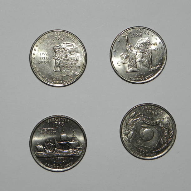 istock US coins on white background 915376634