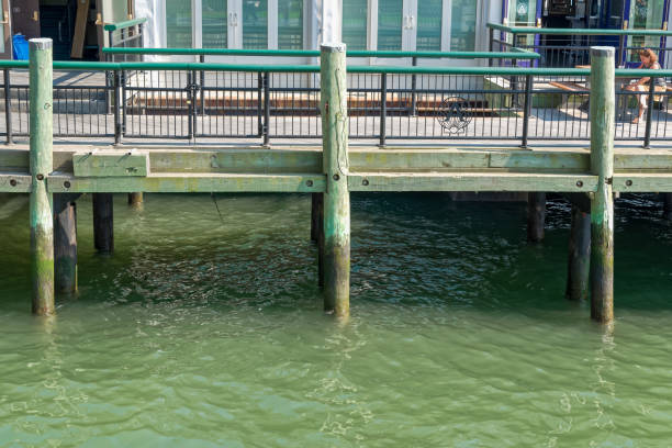 Hystoric Pier A on the Hudson River New York, NY, USA - June 06, 2015: Pier A Harbor House with restaurant situated on the Hudson River at Battery Park, Lower Manhattan. Modern skyscrapers in the background. Blue sky. hystoric stock pictures, royalty-free photos & images