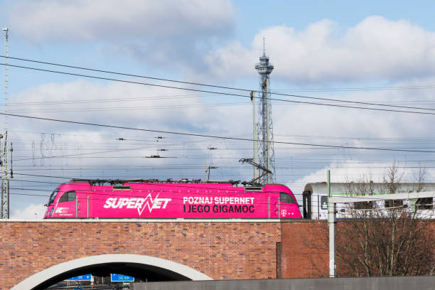pink locomotive on a bridge over a highway in front of the funkturm (radio tower berlin) - berlin radio tower imagens e fotografias de stock