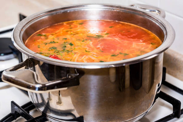 istock Freshly made borscht in saucepan close 915384232