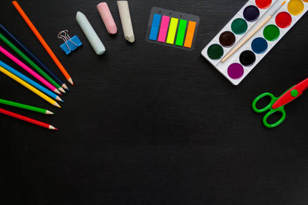 istock stationery flat lay on black chalkboard 915388780