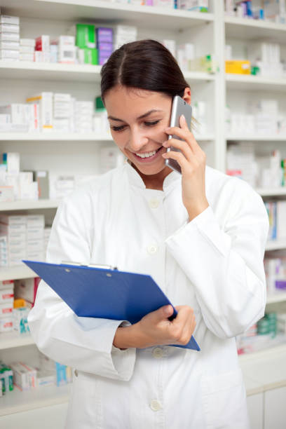 istock Happy young pharmacist talking on the smartphone 915391476