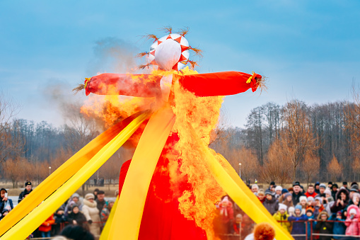Burning Effigies Straw Maslenitsa In Fire On The Traditional National Holiday Dedicated To The Approach Of Spring - Slavic Celebration Shrovetide