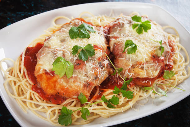 istock Chicken parmesan with spaghetti pasta 915394784