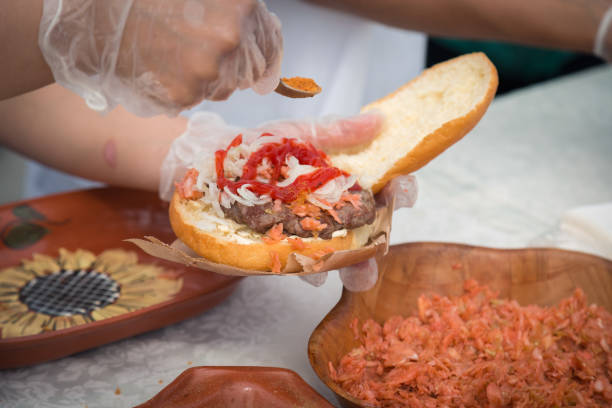 istock cooking burger on the street 915394828