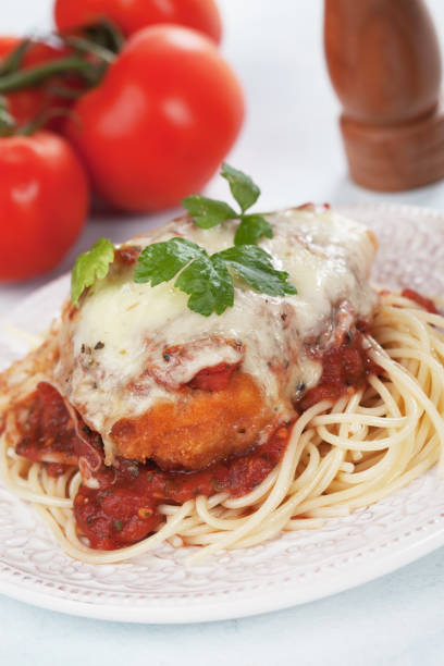 istock Chicken parmesan with spaghetti pasta 915395264