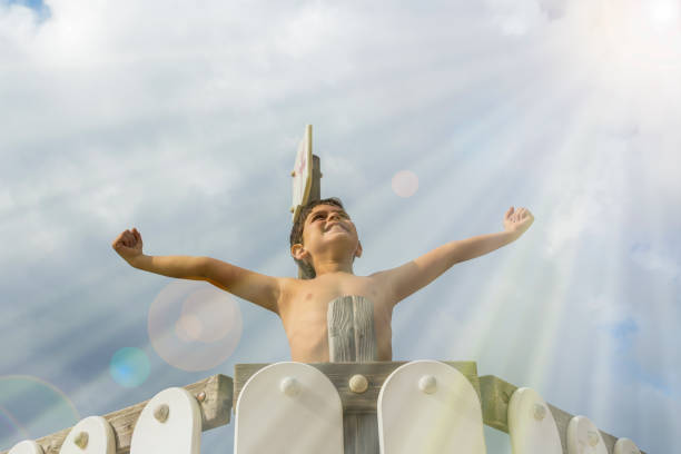 Boy looking at the sky Boy looking at the sky. Spiritual moment religion sunbeam one person children only stock pictures, royalty-free photos & images