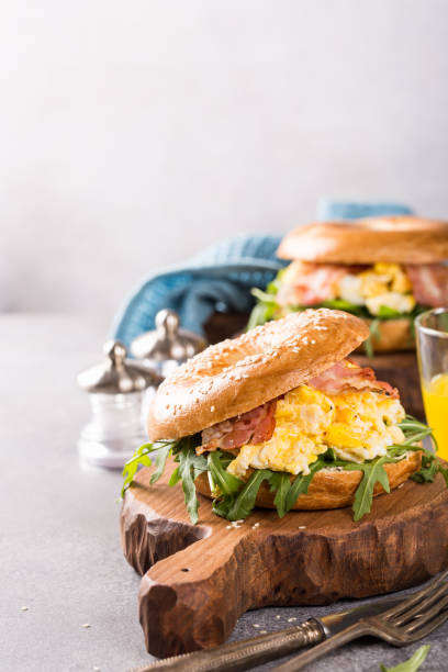 istock Freshly baked bagel filled with scrambled eggs 915395500
