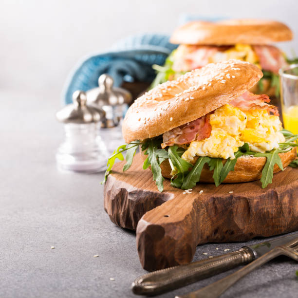 istock Freshly baked bagel filled with scrambled eggs 915395544