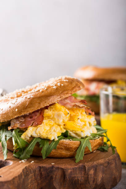 istock Freshly baked bagel filled with scrambled eggs 915395774