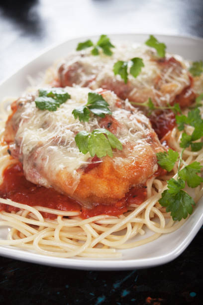 istock Chicken parmesan with spaghetti pasta 915395824