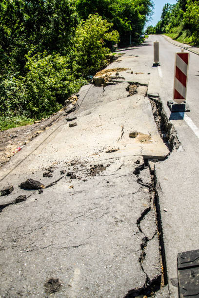 istock Cracked asphalt road 915398336