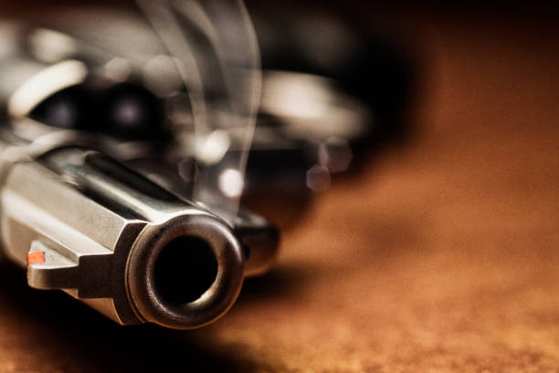 istock Smoking gun lying down on the floor 915398508