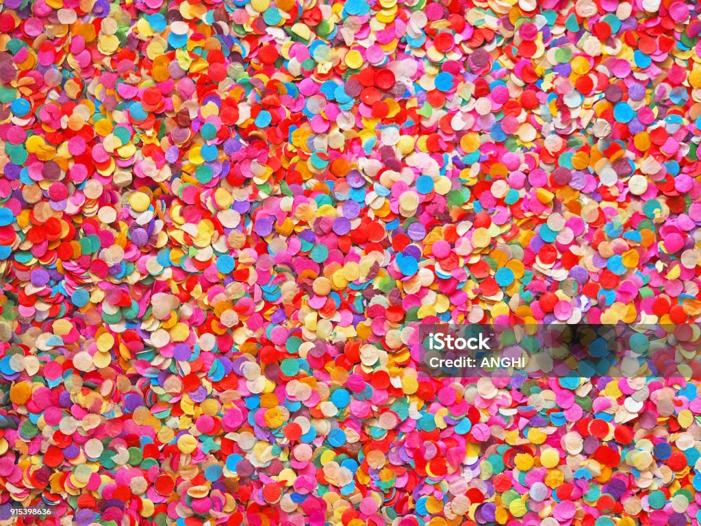 Confetti diversity background. Texture colored circles from paper, close-up. Basis for a festive design or a postcard. Carnival, abstract wedding or birthday backdrop Confetti Stock Photo