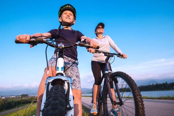 istock Mother and son starting ride a bicykle 915400144
