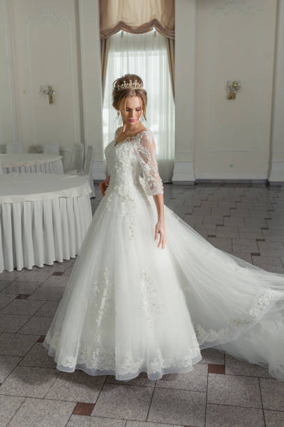 istock A beautiful bride in wedding dress interior 915403794