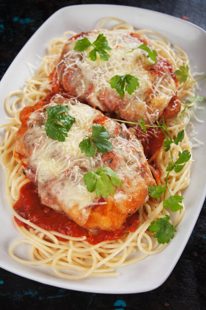 istock Parmesan chicken with spaghetti pasta 915409270