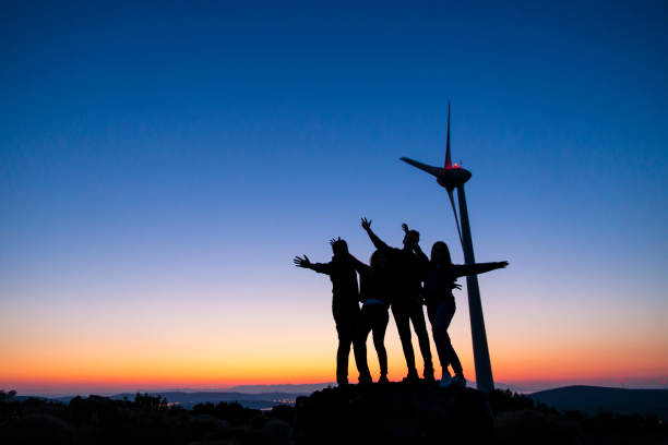 istock Young friends enjoying nature at sunset 915417360