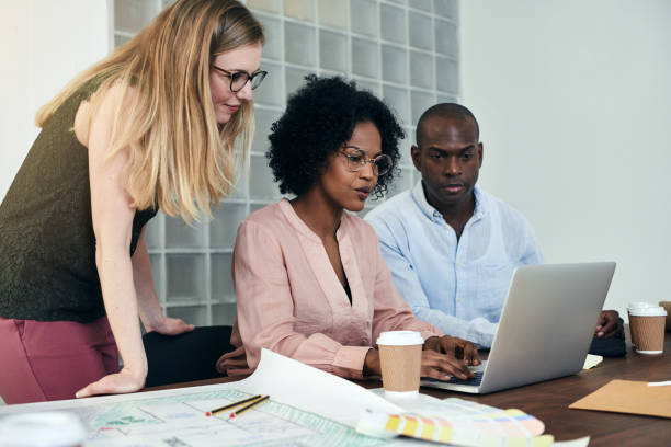 istock Colleagues working together online in a modern office 915419586