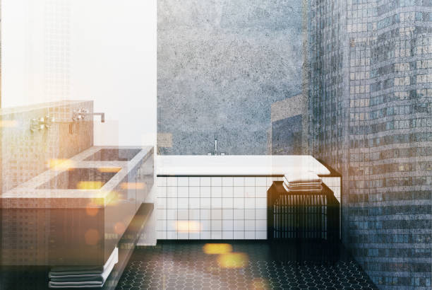 istock Concrete bathroom, tiled tub and sink toned 915424836