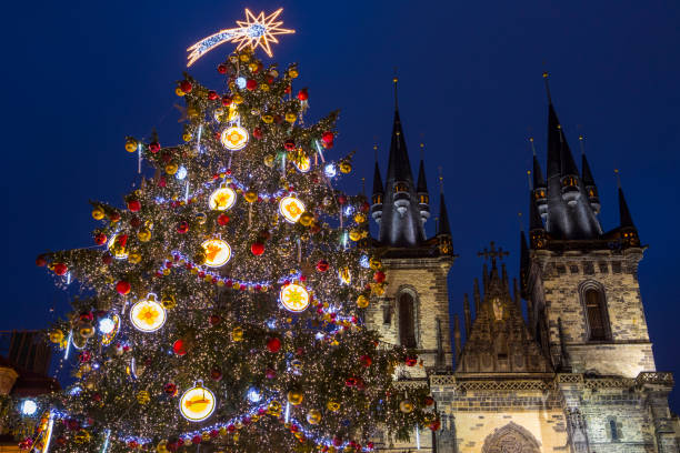 Christmas tree and Tyn Church in the Old Town Square in Prague The beautiful Christmas tree and Tyn Church in the Old Town Square in Prague, Czech Republic. prague christmas market stock pictures, royalty-free photos & images
