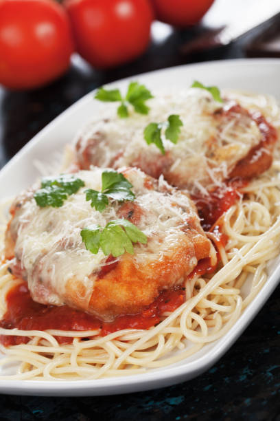 istock Italian chicken parmesan with spaghetti pasta 915430274