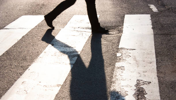 istock One pedestrian crossing the street 915441852