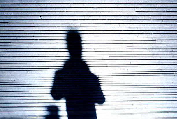 istock Shadow silhouette of people in the night 915442104