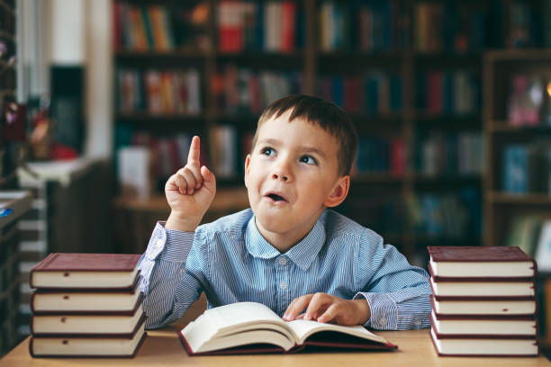 istock European boy explore books 915442458