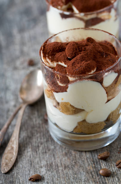 istock tiramisu in glass on wooden surface 915445182