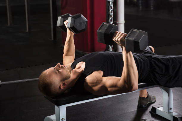 istock Man Exercising With Dumbbell 915447278