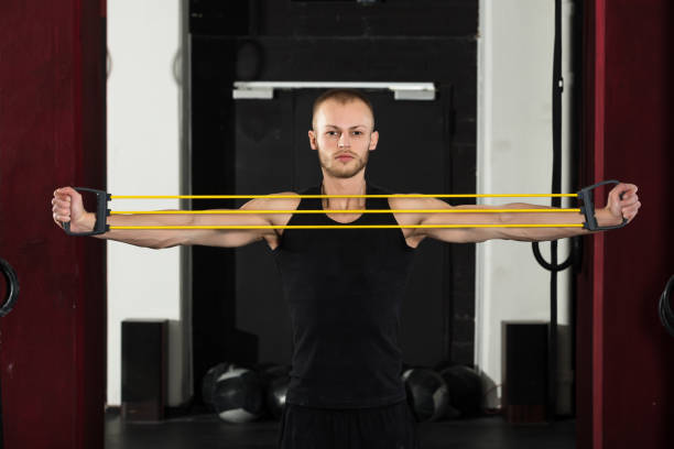 istock An Athlete Man Working With Stretch Band 915447346