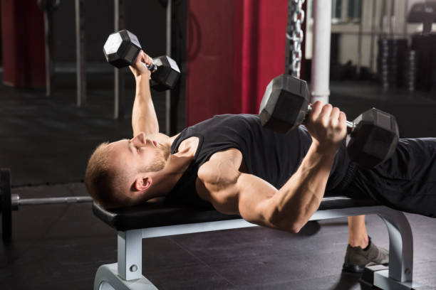 istock Young Man Working Out In Gym 915447448