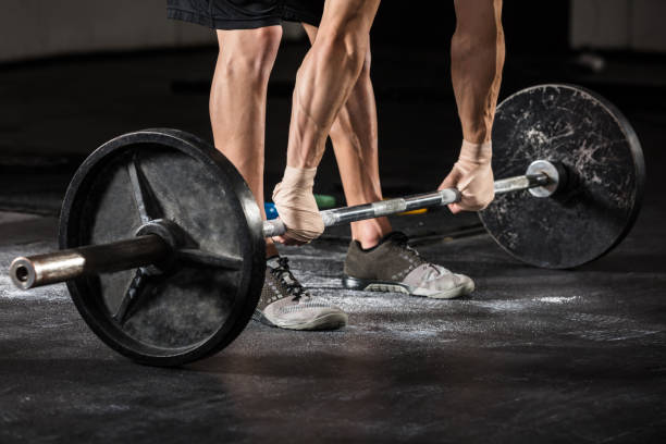 istock Person Lifting Barbell 915447642