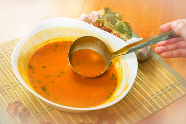 istock Pumpkin soup in a white bowl 915447950