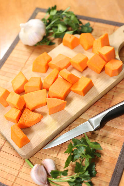istock Raw pumpkin chopped on the cutting board 915447996