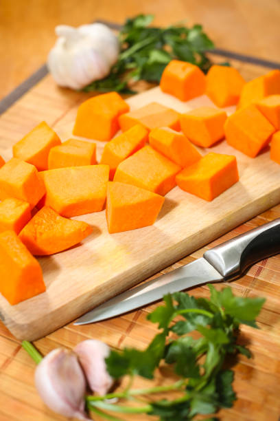 istock Raw pumpkin chopped on the cutting board 915448026