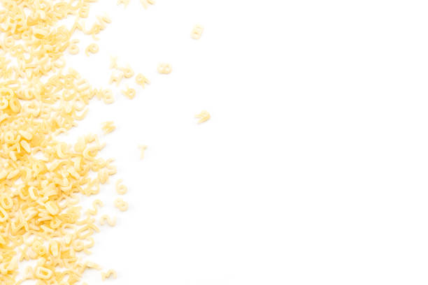 istock background of raw pasta with copy space 915448108