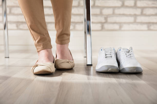 istock Womans Sport Shoes In Office 915448462