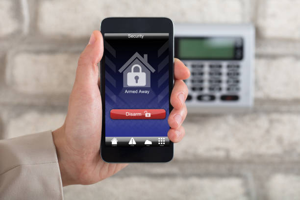 istock Hand Disarming Security System Of Door 915448464
