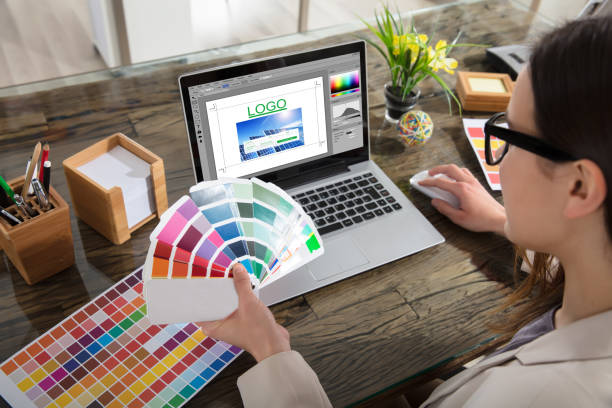 business woman making color selection for logo design - graphic designer imagens e fotografias de stock