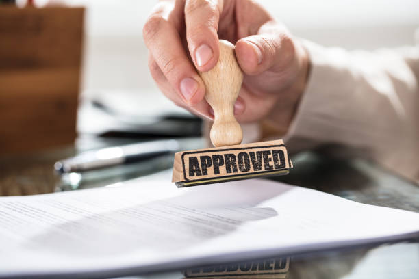 istock Person Holding Approved Stamp On Document 915451212