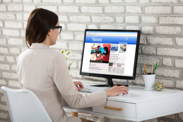 istock Businesswoman Reading News On Computer 915451242
