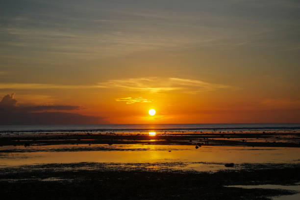 istock Sun setting into the Bali sea 915451500