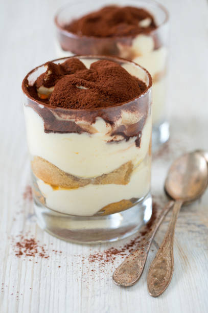 istock tiramisu in glass on wooden surface 915454268