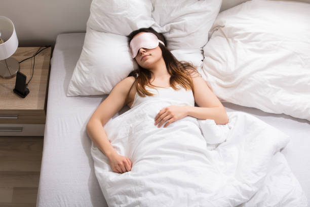 istock Woman Sleeping On Bed 915454356