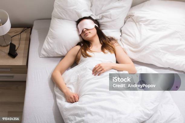 Woman Sleeping On Bed Stock Photo - Download Image Now - Adult, Angle, Beautiful People